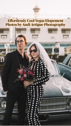 a man and woman standing next to each other in front of a car