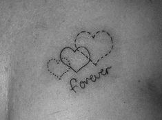 a woman's chest with two hearts and the words forever written on it