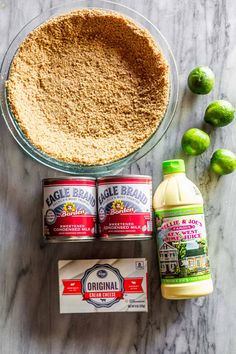 ingredients to make key limeade pie laid out on a marble surface