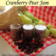 an image of some fruit and jams on a table with the words cranberry pear jam