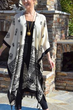 NEW....Luxurious, wool challis kimono/duster in a stunning, elegant pattern of black on a cream background. A lightweight garment to enjoy all year, all seasons. Pair it with dresses, pants and skirts. Great for travel, packs wrinkle free. One size. Fits many sizes from small to X-large. It measures 40 inches from outside edge to outside edge when CLOSED. 80 inches around the body when closed. The length is 45 inches. Dry clean Caftan Tunic, Duster Kimono, Summer Wraps, Kimono Duster, Wool Wrap, Cruise Wear, Elegant Pattern, Womens Kimono, Cream Background