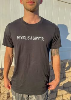 a man wearing a t - shirt that says, my girl is a lawer