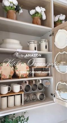 an open cabinet filled with dishes and cups