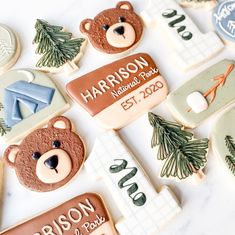 decorated cookies are arranged on a table with the names and date for harrison national park