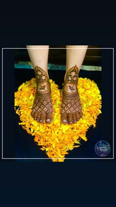 feet with hendix and yellow flowers on them in the shape of a heart