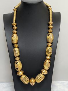 "Necklace of African handmade brass imported beads.   Bold and ethnic.  Wear it at an art opening, wedding, or just out to dinner.  Enjoy its DRAMA!  Approximately 30\"." Luxury Bohemian Beads As Statement Piece, Black African Necklace, Bronze Brass Jewelry With Large Beads, Handmade Beaded Necklaces For Ceremonial Festive Occasions, Festive Handmade Beaded Necklace For Ceremonial Occasions, Festive Handmade Ceremonial Beaded Necklace, Traditional Brass Beaded Necklace With Gold Beads, Bohemian Gold Jewelry With Large Beads, Gold Bohemian Jewelry With Large Beads