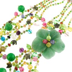 "Green Oasis Flower Gemstone 925 Sterling Silver Art Necklace Pictures cannot do justice to the rich opulence of this necklace. The centerpiece is a stunning flower cut out of solid aventurine. The necklace strap is richly beaded composition of cultured pearls and gemstones. Finished with 925 sterling. This necklace is a work of art. Pendant Size: 2 1/2\" flower Gemstone Type: Aventurine, carnelian, crystal Lock Type: Hook, 925 silver Necklace Size: 30\" Necklace Weight: ~11oz Price: 76.95" Necklace Pictures, Flower Oasis, Flower Cut Out, Green Oasis, Art Necklace, Carnelian Crystal, Art Necklaces, Art Pendant, Silver 925 Necklace