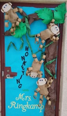 a door decorated with paper and monkey decorations