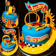 a birthday cake with hot wheels decorations on it