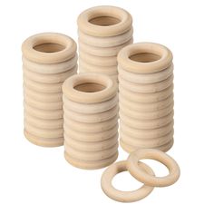 several wooden rings and o - rings on a white background