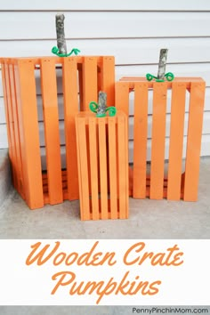 wooden crate pumpkins with green bows on them