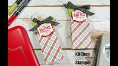 two kitchen items are sitting next to each other on a table with the words kitchen stamper