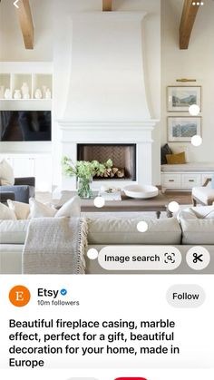 a living room filled with furniture and a fire place next to a white fireplace covered in candles