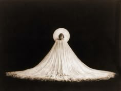 an image of a woman in a long white dress with the moon above her head