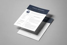 a professional resume template is shown on top of a sheet of paper with the cover pulled open