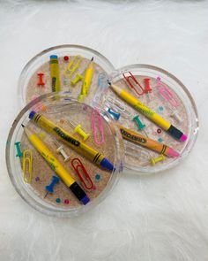 two plastic trays filled with different colored markers