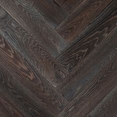 an image of wood flooring that looks like herringbones