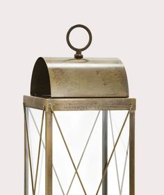 an old fashioned lantern with a metal handle