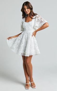 Get ready to turn heads in the Marisole Mini Dress! This stunning A-line flutter sleeve lace dress in white is perfect for any party day or night. The sweetheart neckline and mini length add a flirty touch, while the short sleeves provide just the right amount of coverage. Made from high-quality polyester, this dress is both comfortable and stylish. Whether you're attending a special occasion or simply want to feel fabulous, the Marisole Mini Dress is the perfect choice. Don't wait - make a stat Drake Wedding, White Dress Short, Fancy Short Dresses, Cute Formal Dresses, Sleeve Lace Dress, Lace Dress With Sleeves, Korean Fashion Dress, White Short Dress, Sleeves Dress