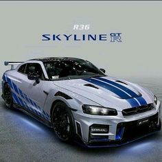 a white and blue sports car is shown in this advertisement for the skyline group