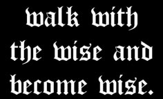 the words walk with the wise and become wise on a black background, in white