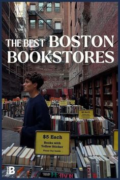 the best boston bookstories book sale in new york city, with a boy standing behind stacks of books