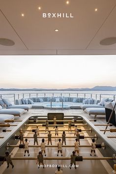 A dark gray outdoor football table with wooden handles set on a wooden deck of a luxurious yacht Spanish Games, Outdoor Living Space Design, Outdoor Dining Furniture, Outdoor Kitchen Design, Stainless Steel Frame, Outdoor Entertaining, Patio Decor, Outdoor Living Space, Outdoor Kitchen