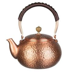 a copper tea pot with a handle on the top and a wooden handle at the bottom