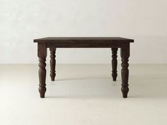 a small wooden table sitting on top of a white floor