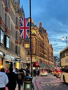 people are walking down the street in london