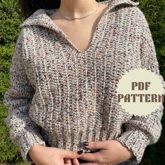 a woman wearing a knit sweater with the words free knitting pattern on it, in front of green grass