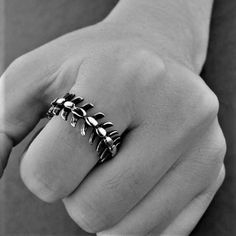 Introducing our Spine Bone Ring, a bold and unique piece that will add an edgy touch to any outfit. Made from high-quality stainless steel, this ring features a realistic spine bone design that wraps around your finger. Crafted with attention to detail, our Spine Bone Ring is a statement piece that is perfect for those who love unconventional jewelry. The stainless steel construction ensures that this ring is durable and long-lasting, so you can wear it for years to come. The Spine Bone Ring is also a great gift for any friend or family member who loves alternative fashion or Gothic style. It is perfect for wearing to parties, concerts, or just as an everyday accessory. Made from highest quality 316L Stainless Steel Guaranteed to last a lifetime. Won't Rust or Fade Unconventional Jewelry, Spine Bone, Bone Ring, Unique Jewelry Designs, Everyday Accessories, Gothic Style, The Source, Steel Construction, Gothic Fashion