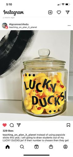 a glass jar filled with yellow rubber ducks