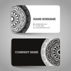 a business card with an ornamental design on it, and a black and white background