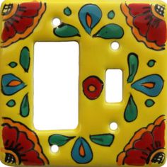 a decorative light switch cover with flowers painted on the front and back sides, in yellow