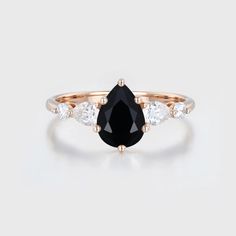 The 1.5 Ct Pear Shape Black Onyx Ring in 14K Rose Gold is more than a piece of jewelry; it's a reflection of your love's depth and the enduring beauty of your connection.
Embrace the beauty of this ring as it becomes a cherished symbol of your love, joy, and commitment Black Love Ring, Black Pear Shape Engagement Ring, Black Onyx Engagement Ring Zales, Moss Agate Engagement Ring, Agate Engagement Ring, Unique Roses, Side Stone Engagement Ring, Black Onyx Ring, Stone Engagement Ring