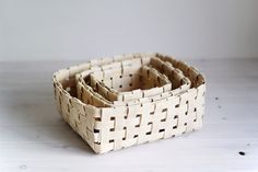 a white basket that is sitting on a table