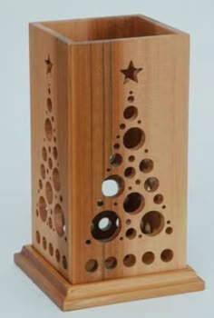 a wooden box with holes in it