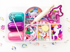 a plastic container filled with lots of different types of toys and accessories on top of a table