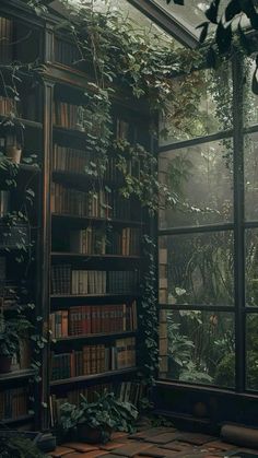 a room filled with lots of books next to a window covered in plants and greenery