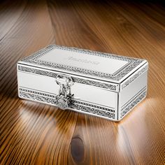 a white box sitting on top of a wooden table