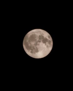 the full moon is seen in the dark sky