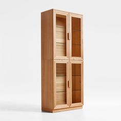 a tall wooden cabinet with two glass doors