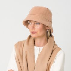 Look effortlessly cool in Heather Lynn’s new Cashmere bucket hats; crafted from ultra-soft organic cashmere and merino wool; they make an understated fashion statement. Inspired by the 1990s casual bucket hat silhouette with a 1950s-inspired cloche style, Heather Lynn has reinvented this iconic item with a shorter brim to wear low on the forehead without wrecking your hair.  Available in camel, navy, black, grey and stone. 100% Cashmere  (stone, camel, navy) and 30% Organi Cashmere / 70% Merino Understated Fashion, Hat Silhouette, Stocking Fillers For Her, Black Camel, Bucket Hats, Cashmere Coat, Mens Jewelry Bracelet, The 1990s, Independent Designers Fashion