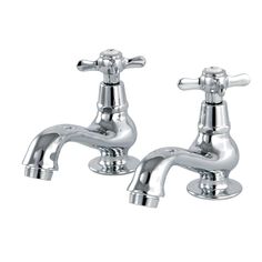 two chrome faucets on white background