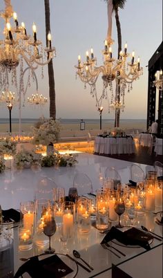 a table is set up with candles and centerpieces