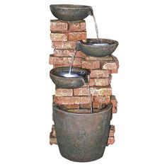 a water fountain with two buckets on top of it and the words, toscano authorized resiller