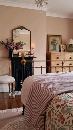 a bedroom with a bed, dresser and mirror in it's centerpieces