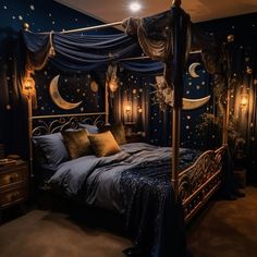 a canopy bed in a bedroom decorated with stars and moon decorations