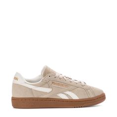 The 80s were a time of stylish footwear, and you can take your style back to those days in the Reebok Club C Grounds UK Women's Sneakers. Plus, with the perforations in the toe box, you'll reap the reward of added breathability. The suede material is soft and gives these that old-school feel, but the synthetic leather overlays take the style up a notch.Features: Perforations for breathability. Padded tongue and collar. Cushioned insole. Rubber midsole and outsole. Details: Lace-up. Materials: up Fall Sneakers Women, Rebook Shoes Vintage, Rebook Shoes Platform, Creme Shoes, Neutral Sneakers Women, Brown Reebok Shoes, Tan Reebok Shoes, Trendy Sneakers For Women, Rebook Club C Double